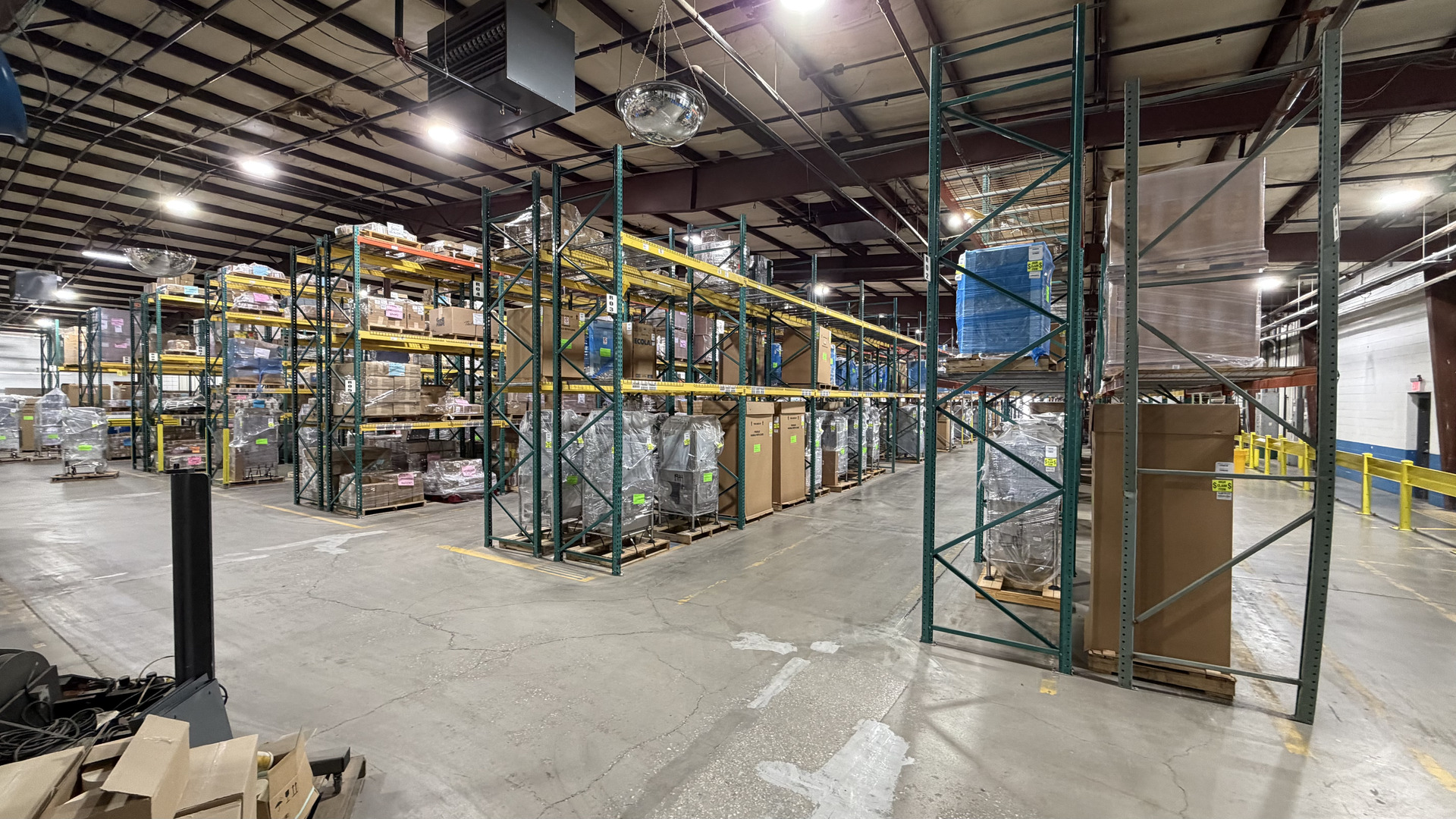 Racked pallet storage and open floor space in the TCO warehouse